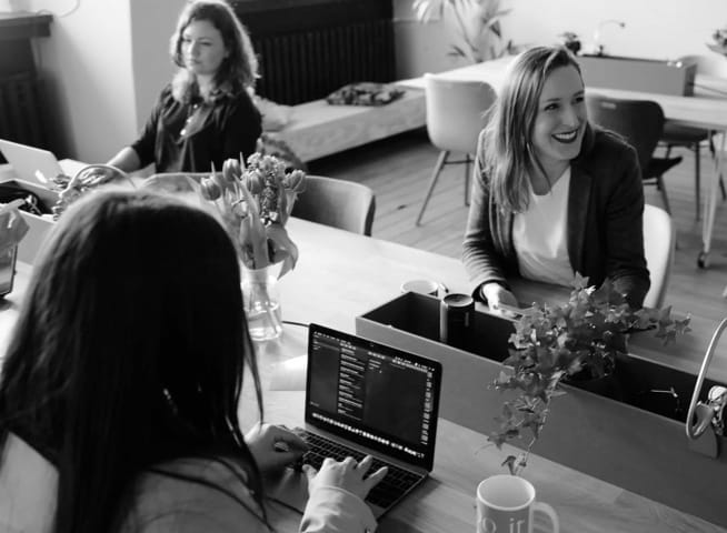 Business women analyzing data in a modern office setup
